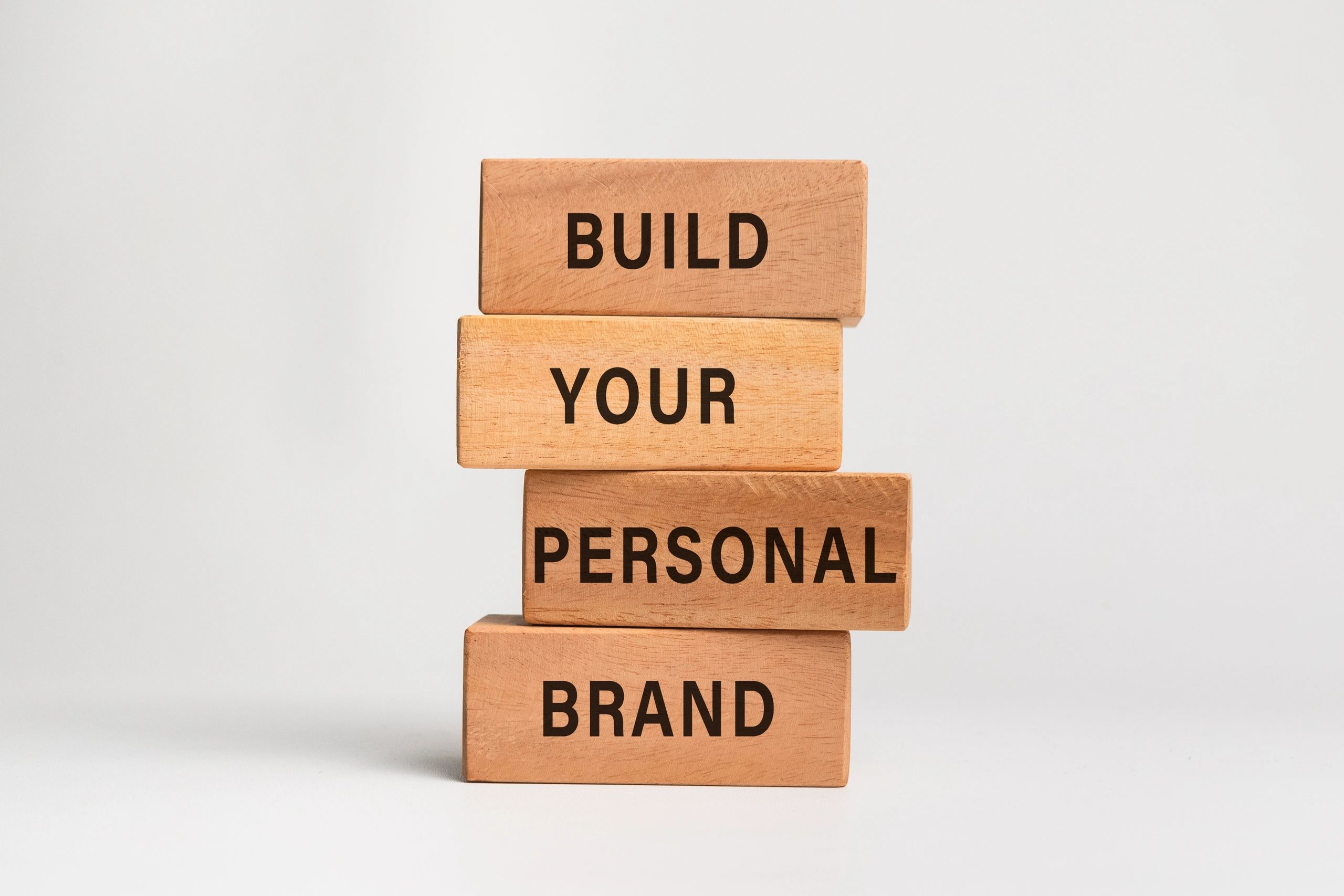 build you personal brand words text on wooden